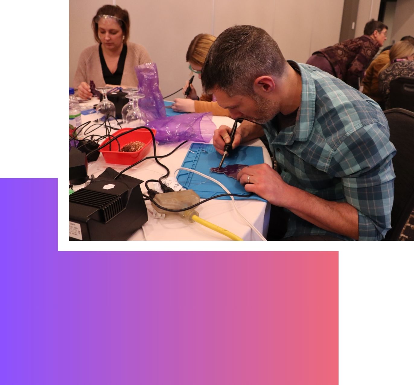 teachers soldering at the 2023 learning and teaching retreat